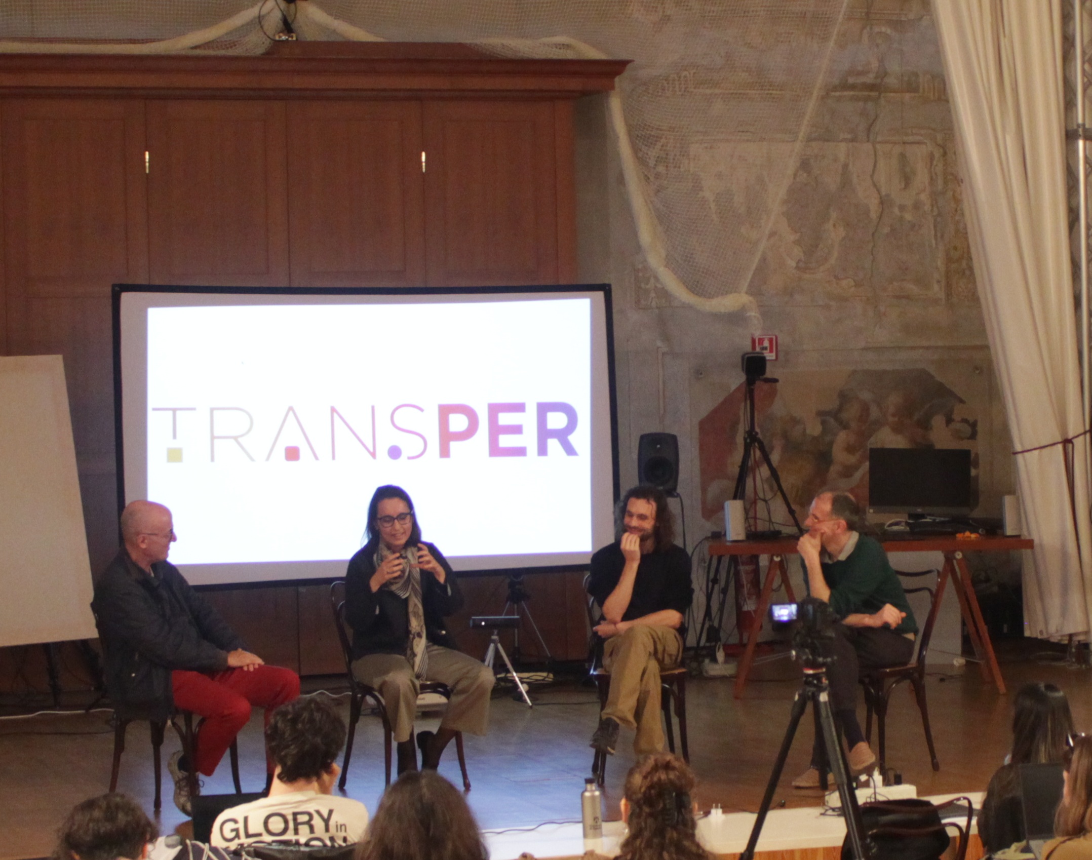 Four speakers in interaction at the round table